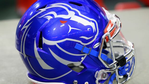 A closeup of a blue Boise State football helmet.