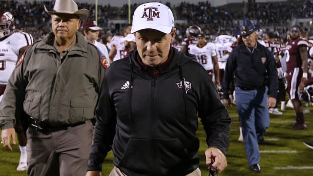 jimbo fisher walks off the field after a Texas A&M football game