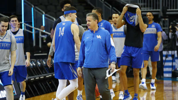 Coach Cal looks on during ncaa tournament practice.