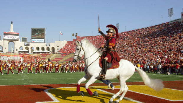 USC's mascot riding on a white horse in the end zone.