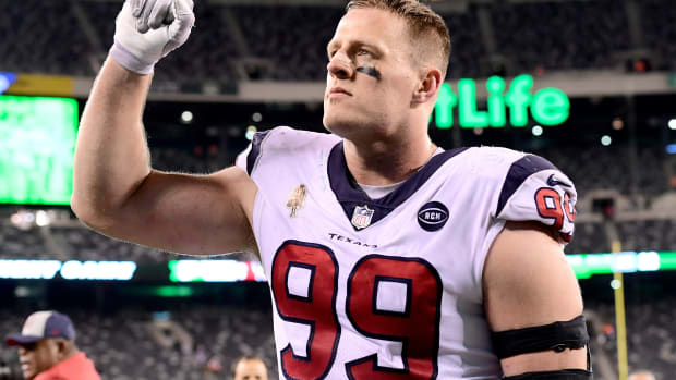 J.J. Watt raising his arm.