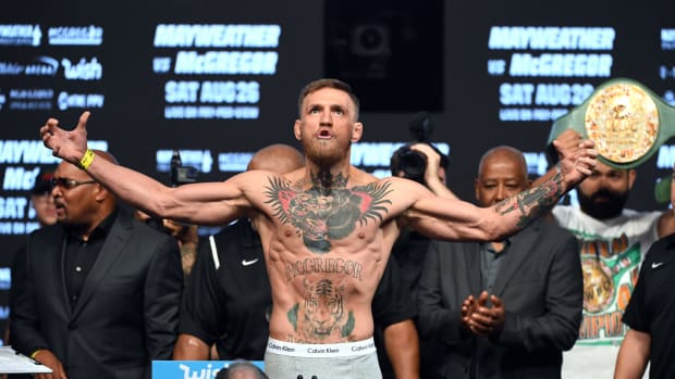 Conor McGregor flexing during his weigh in.