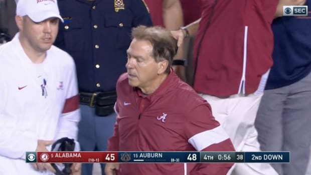 Nick Saban throws his headset at an assistant after Alabama hands away the game to Auburn.