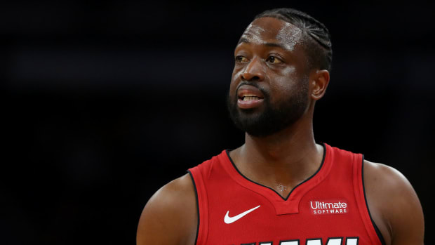 A closeup of Dwyane Wade in a red Miami Heat jersey.