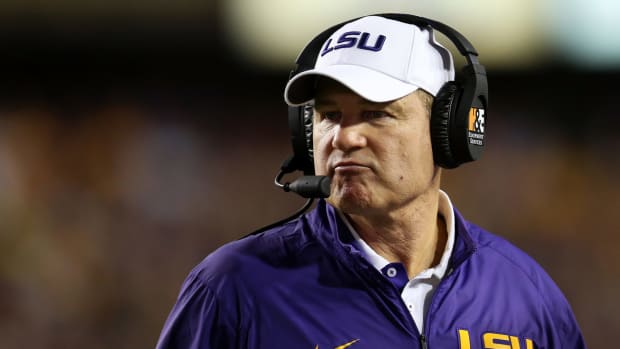 LSU coach Les Miles hangs on the sideline during a game against Texas A&M.