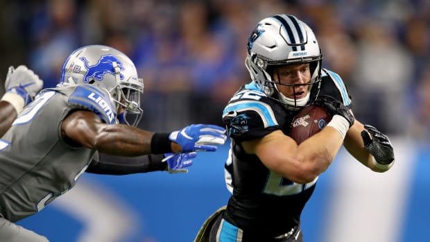 Christian McCaffrey runs the ball for the Carolina Panthers against the Detroit Lions.