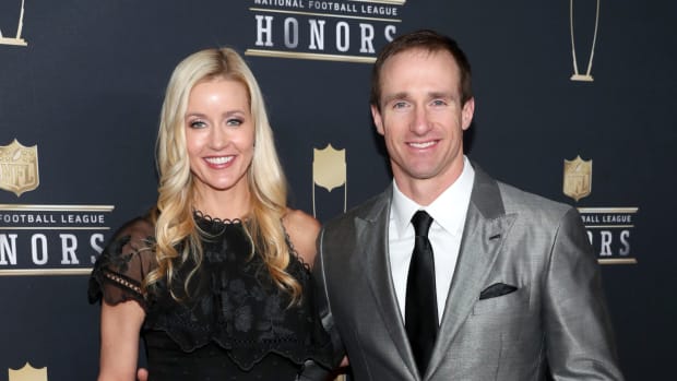 Drew and Brittany Brees pose together.