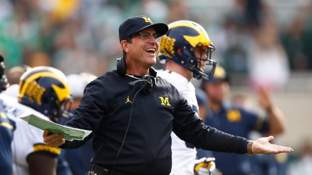 Head coach Jim Harbaugh reacts on the sidelines.