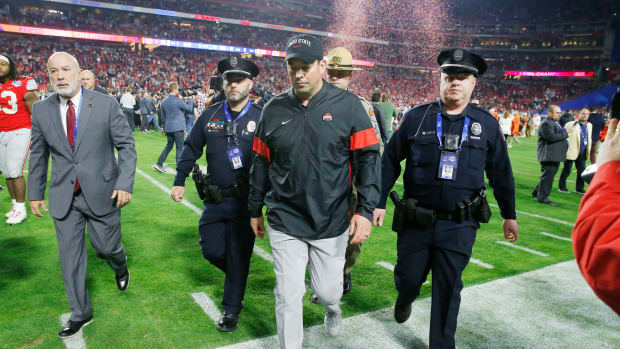 Ohio State head coach Ryan Day walks off the field after the Fiesta Bowl.