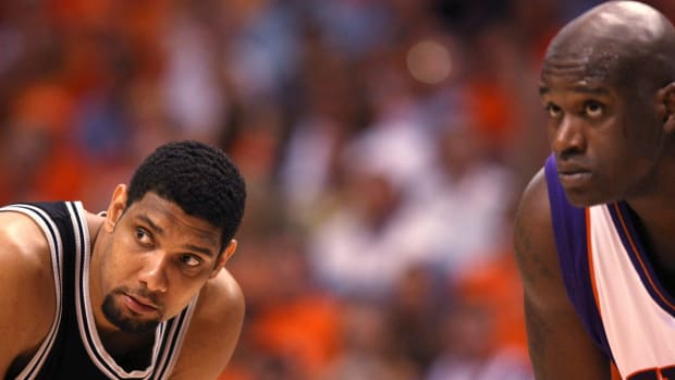 Shaquille O'Neal and Tim Duncan during a Spurs vs. Suns game.
