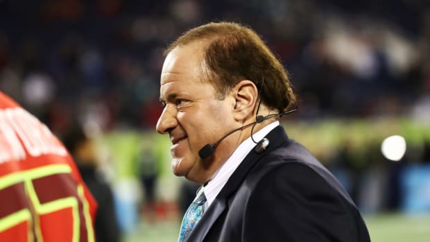 chris berman smiles during a broadcast of the nfl pro bowl