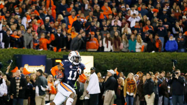 Chris Davis #11 of the Auburn Tigers returns a missed field goal for the winning touchdown in their 34 to 28 win over the Alabama Crimson Tide at Jordan-Hare Stadium.