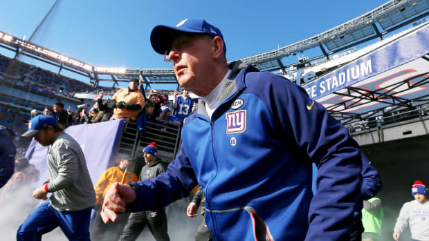 Tom Coughlin running onto the field.