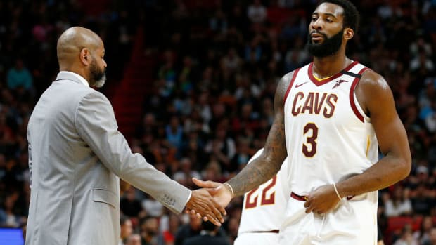 Andre Drummond shakes hands with Cavs head coach J.B. Bickerstaff.