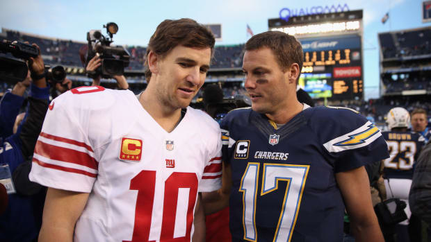 Eli Manning and Philip Rivers shake hands after a game.