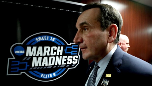 A closeup of Mike Krzyzewski walking in the tunnel during an NCAA Tournament game.