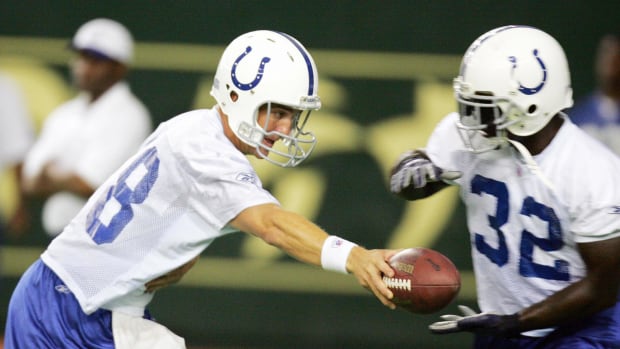 Peyton Manning hands off to Colts teammate Edgerrin James during practice.