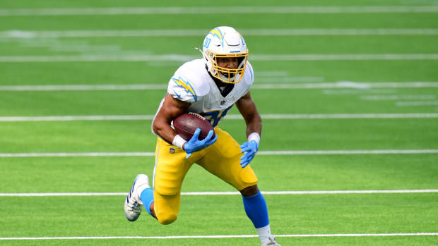 Austin Ekeler runs the football for the Chargers.
