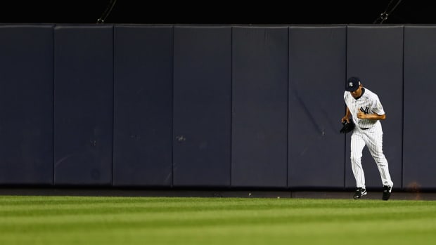 Mariano Rivera jogging onto the field at Yankee Stadium.