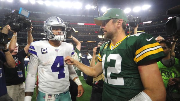 Aaron Rodgers and Dak Prescott at midfield after a Packers-Cowboys game.
