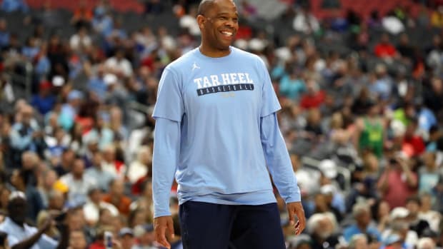 Hubert Davis smiles during a UNC practice at the Final Four.