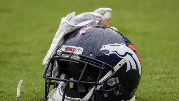 Denver Broncos helmet on the field.
