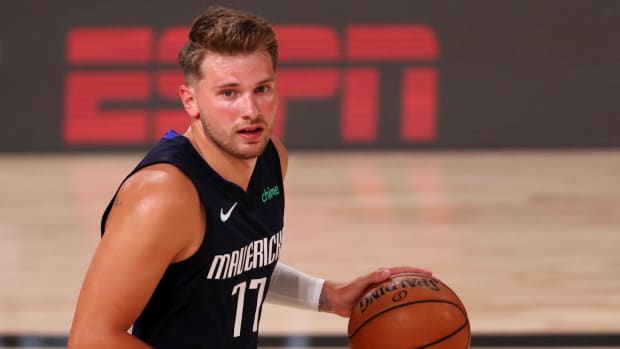 Dallas Mavericks star Luka Doncic dribbles the ball against the Houston Rockets in the NBA bubble.