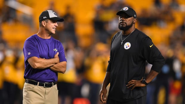 Mike Tomlin and John Harbaugh talk before a Pittsburgh Steelers vs. Baltimore Ravens game.