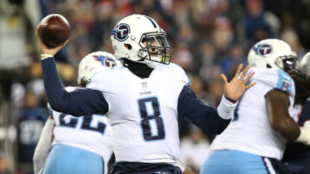 Marcus Mariota, now with the Las Vegas Raiders after leaving the Tennessee Titans, winding up to throw a pass.
