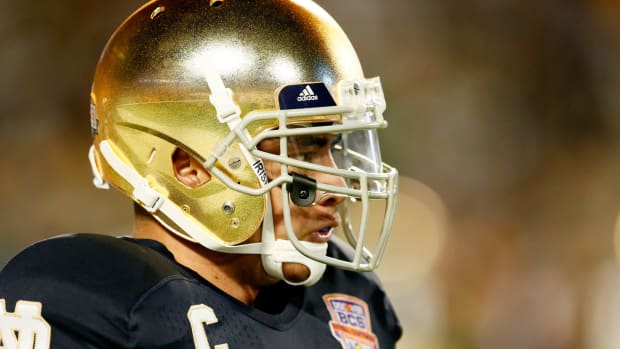 A closeup of Manti Te'o in his Notre Dame football helmet.