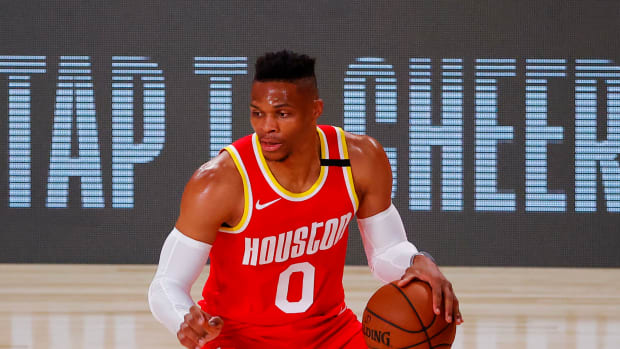 Russell Westbrook dribbling the ball for the Houston Rockets.