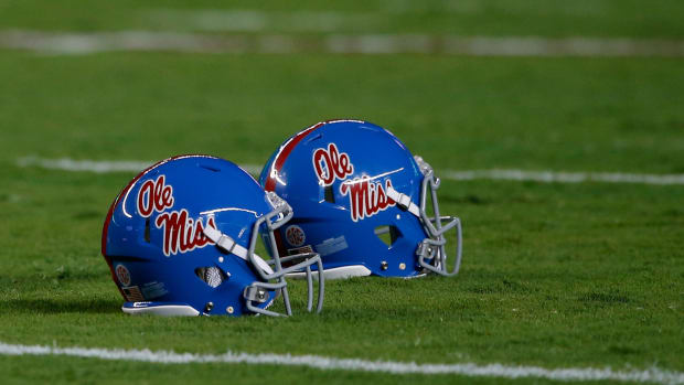 Ole Miss helmets on the field during a game.