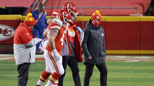 Eric Fisher gets helped off of the field.