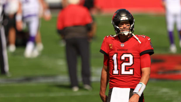 Tom Brady #12 of the Tampa Bay Buccaneers warms up before their game against the Minnesota Vikings