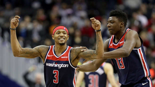 Bradley Beal #3 of the Washington Wizards celebrates with Thomas Bryant #13 after hitting a three pointer