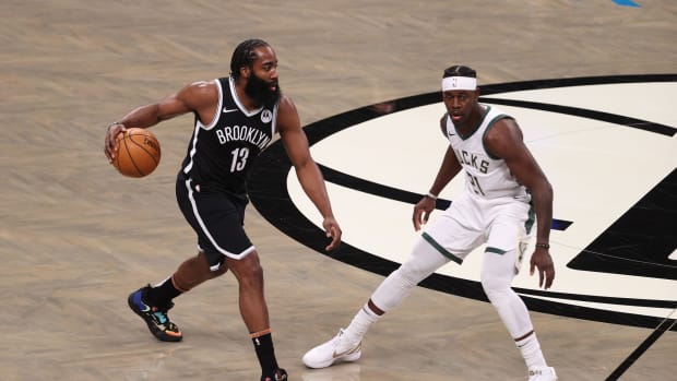 James Harden dribbling up the court for the Nets.