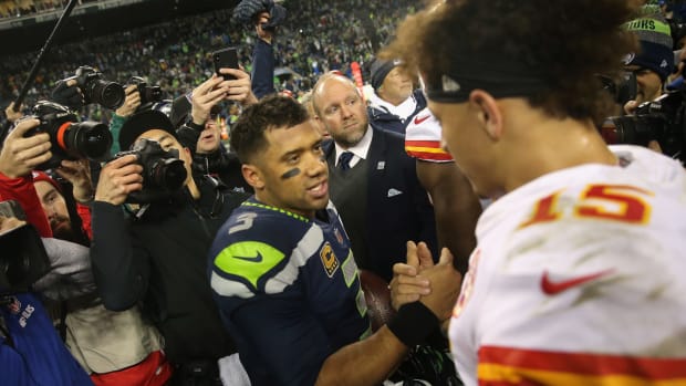 Seattle Seahawks QB Russell Wilson shakes hands with NFL MVP Patrick Mahomes of the Kansas City Chiefs.