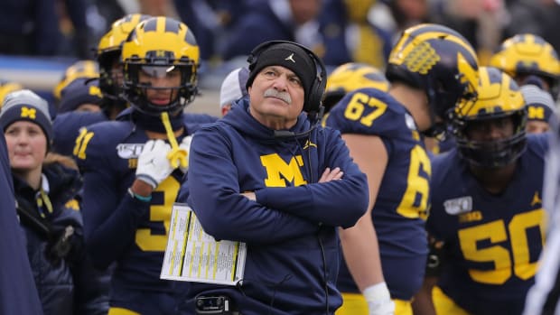 Don Brown looks on from the sideline.