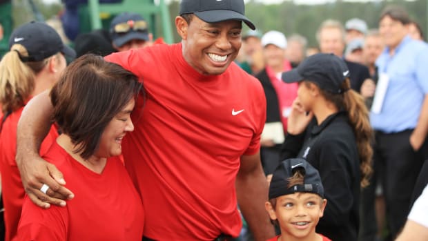 Tiger Woods celebrates with son Charlie Woods