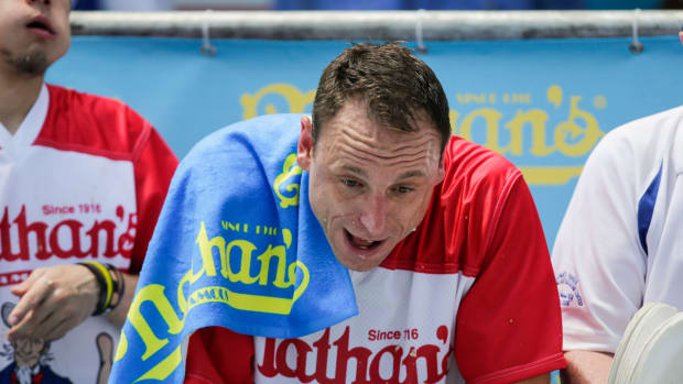 Joey Chestnut eating hot dogs.