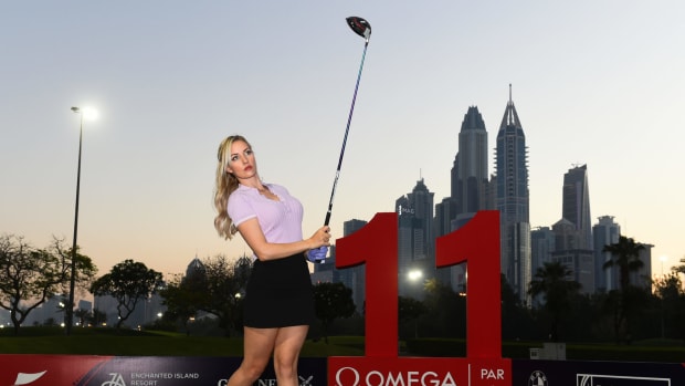 Paige Spiranac drives off the tee.