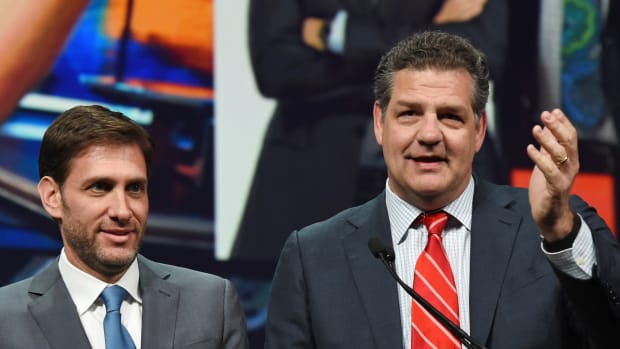 Mike Golic and Mike Greenberg at an awards show.