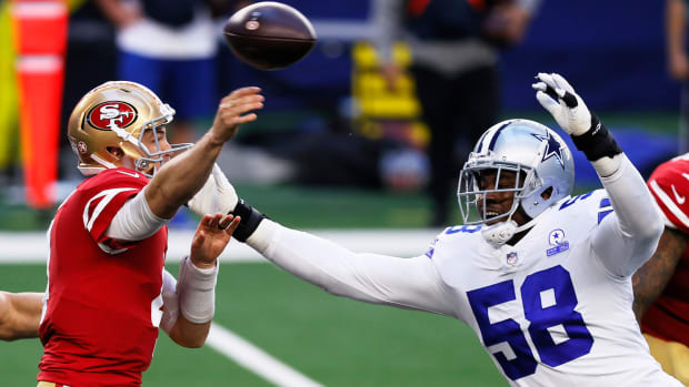 Aldon Smith tries to sack the quarterback for the Dallas Cowboys.