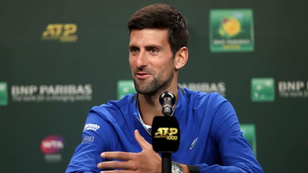 A closeup of Novak Djokovic speaking to the media.