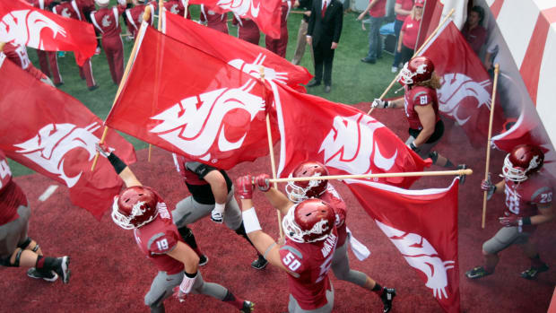 The Washington State Cougars take the field against the Oregon State Beavers in a Pac-12 football game.