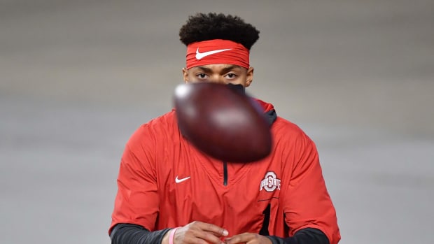 Ohio State quarterback Justin Fields warms up before a game. He was drafted by the Chicago Bears in 2021.