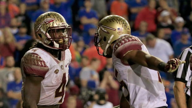 Dalvin Cook and Travis Rudolph celebrating a Florida State touchdown.