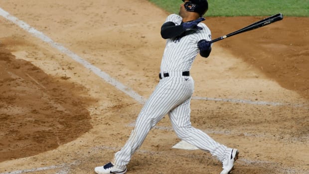 Aaron Hicks follows through on a swing at the plate