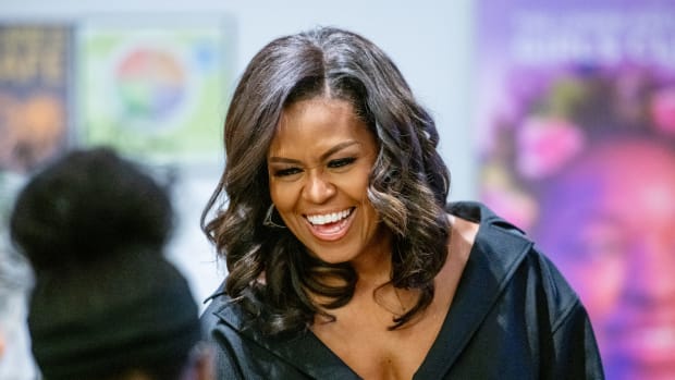 Michelle Obama smiles at a book signing in New York City.