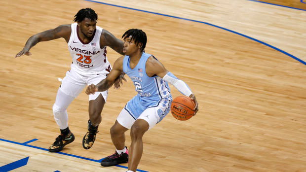 North Carolina guard Caleb Love dribbling the ball against Virginia Tech.